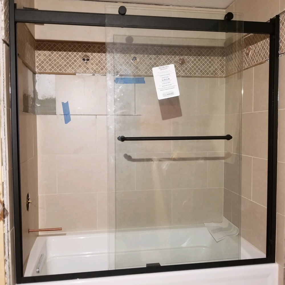 crop image of bypass slider over tub by the Shower Door Specialists